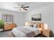 Bright and inviting bedroom with neutral tones, plush bedding, and warm bedside lighting at 541 W Vernon Ave, Phoenix, AZ 85003