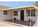 Charming exterior with a cozy porch, wrought iron details, and flower pots at 541 W Vernon Ave, Phoenix, AZ 85003