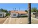 Charming white home featuring drought-resistant landscaping, an orange tiled roof, and a paved driveway and walkway at 541 W Vernon Ave, Phoenix, AZ 85003