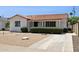 Attractive single-story home featuring desert landscaping, a red tile roof, and a walkway to the front door at 541 W Vernon Ave, Phoenix, AZ 85003