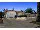 Well-maintained home showcasing landscape lighting, desert landscaping and a traditional red tile roof at 541 W Vernon Ave, Phoenix, AZ 85003