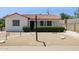 Attractive single-story home featuring desert landscaping, a red tile roof, and a walkway to the front door at 541 W Vernon Ave, Phoenix, AZ 85003