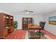 Spacious home office features a desk, bookshelves, and natural light, perfect for productivity at 541 W Vernon Ave, Phoenix, AZ 85003