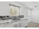 Bright kitchen featuring modern tile backsplash and stainless steel sink at 541 W Vernon Ave, Phoenix, AZ 85003