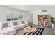 Bright living room features a large window, modern sofa, and stylish striped rug at 541 W Vernon Ave, Phoenix, AZ 85003