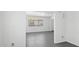 Bright living room area with white walls, gray flooring, and natural light at 541 W Vernon Ave, Phoenix, AZ 85003