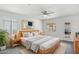 A serene main bedroom offers a cozy ambiance with soft lighting and a king-sized bed at 541 W Vernon Ave, Phoenix, AZ 85003