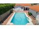 Stunning rectangular pool surrounded by a brick patio, perfect for outdoor relaxation and entertaining at 541 W Vernon Ave, Phoenix, AZ 85003