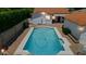 Aerial view of a sparkling private pool surrounded by brick and mature landscaping at 541 W Vernon Ave, Phoenix, AZ 85003