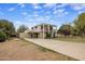 Spacious home with a long driveway and attached carport, featuring a second story balcony at 55 E Pierson St, Phoenix, AZ 85012