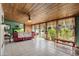 Cozy sunroom with wood ceiling, large windows, tile floors and comfortable seating at 55 E Pierson St, Phoenix, AZ 85012