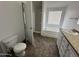 Bathroom showcases soaking tub, tiled floors, a clear glass shower enclosure, and toilet at 625 W Mckellips Rd # 236, Mesa, AZ 85201