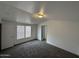 Bedroom with neutral carpet, a window, and an en-suite bathroom at 625 W Mckellips Rd # 236, Mesa, AZ 85201