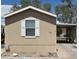 Inviting single-story home with a neutral color palette and a convenient covered parking area at 625 W Mckellips Rd # 236, Mesa, AZ 85201