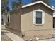 Angle showing the side and front of this single-story home with a covered parking area at 625 W Mckellips Rd # 236, Mesa, AZ 85201