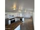 Kitchen with stainless appliances, white cabinets, and an island with butcher block countertop at 625 W Mckellips Rd # 236, Mesa, AZ 85201