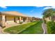Spacious backyard with a lush lawn and covered patio at 6602 S Constellation Way, Gilbert, AZ 85298