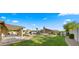 Beautifully landscaped backyard with a refreshing pool, a pergola, and plenty of green space at 6602 S Constellation Way, Gilbert, AZ 85298
