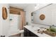 Stylish bathroom featuring a wood accent wall and modern decor at 6602 S Constellation Way, Gilbert, AZ 85298