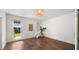 Bright bedroom with wood floors, large window, and sliding door to a fenced yard offers a serene retreat at 6602 S Constellation Way, Gilbert, AZ 85298