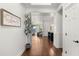 Inviting hallway with hardwood floors and views into the living spaces at 6602 S Constellation Way, Gilbert, AZ 85298