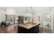 Stylish kitchen with a large island, pendant lights, granite countertops, and views of the living room at 6602 S Constellation Way, Gilbert, AZ 85298