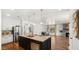 Spacious kitchen featuring a large island with a sink, stainless steel appliances, and an open layout at 6602 S Constellation Way, Gilbert, AZ 85298