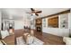 Bright living room features a stone fireplace, wood beam mantel, and built-in shelves, creating a cozy and stylish atmosphere at 6602 S Constellation Way, Gilbert, AZ 85298