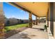 Covered patio with stone pillars overlooking a spacious backyard at 6602 S Constellation Way, Gilbert, AZ 85298