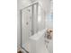 Modern shower with glass enclosure, rainfall showerhead, and sleek design at 6602 S Constellation Way, Gilbert, AZ 85298