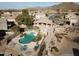 Aerial shot of a community pool area with a spa, benches and desert landscaping at 6631 E Rhodes St, Mesa, AZ 85215