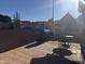 Desert landscaping frames the back patio with a grill and outdoor dining area at 6631 E Rhodes St, Mesa, AZ 85215
