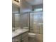Standard bathroom with a sink, toilet, and shower and tub combo with glass doors at 6631 E Rhodes St, Mesa, AZ 85215