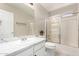 Bathroom featuring tub/shower combination with sliding glass doors, sink with vanity, and bright lighting at 6631 E Rhodes St, Mesa, AZ 85215