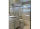 Clean bathroom with a white vanity, white tiled shower, and modern fixtures at 6631 E Rhodes St, Mesa, AZ 85215