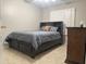 Comfortable bedroom featuring a cozy bed and a dresser at 6631 E Rhodes St, Mesa, AZ 85215