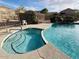 An inviting pool and spa with waterfall feature at 6631 E Rhodes St, Mesa, AZ 85215