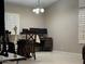 View of the dining area with a table and computer desk at 6631 E Rhodes St, Mesa, AZ 85215