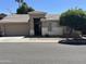 Charming single-story home with a well-maintained front yard and attached two-car garage at 6631 E Rhodes St, Mesa, AZ 85215
