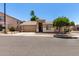 Attractive single-story home with a two-car garage, desert landscaping, and a welcoming entrance at 6631 E Rhodes St, Mesa, AZ 85215