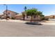 Inviting single story home featuring a two-car garage, low maintenance landscaping, and a neutral paint scheme at 6631 E Rhodes St, Mesa, AZ 85215