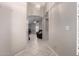 Inviting hallway with tile floors and arched doorways that lead to a spacious living area at 6631 E Rhodes St, Mesa, AZ 85215