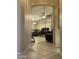 Hallway view into a dining and living area with tile flooring and neutral paint at 6631 E Rhodes St, Mesa, AZ 85215