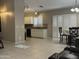 View of the living area with ceramic tile, neutral paint and access to kitchen at 6631 E Rhodes St, Mesa, AZ 85215