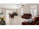 Spacious living area with a vaulted ceiling, neutral walls, and a modern ceiling fan at 6631 E Rhodes St, Mesa, AZ 85215