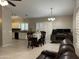 Spacious living area with kitchen, dining table, and a comfortable workspace at 6631 E Rhodes St, Mesa, AZ 85215