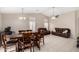 Open-concept living and dining area with vaulted ceilings, tile floors, and ample natural light at 6631 E Rhodes St, Mesa, AZ 85215