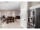 Open-concept living area showcasing modern appliances, a dining set, and stylish furniture at 6631 E Rhodes St, Mesa, AZ 85215