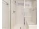 Modern walk-in shower featuring grab bars and a built-in bench at 6631 E Rhodes St, Mesa, AZ 85215