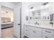 Stylish bathroom with white cabinetry and a clear view into the primary bedroom at 6831 E Presidio Rd, Scottsdale, AZ 85254